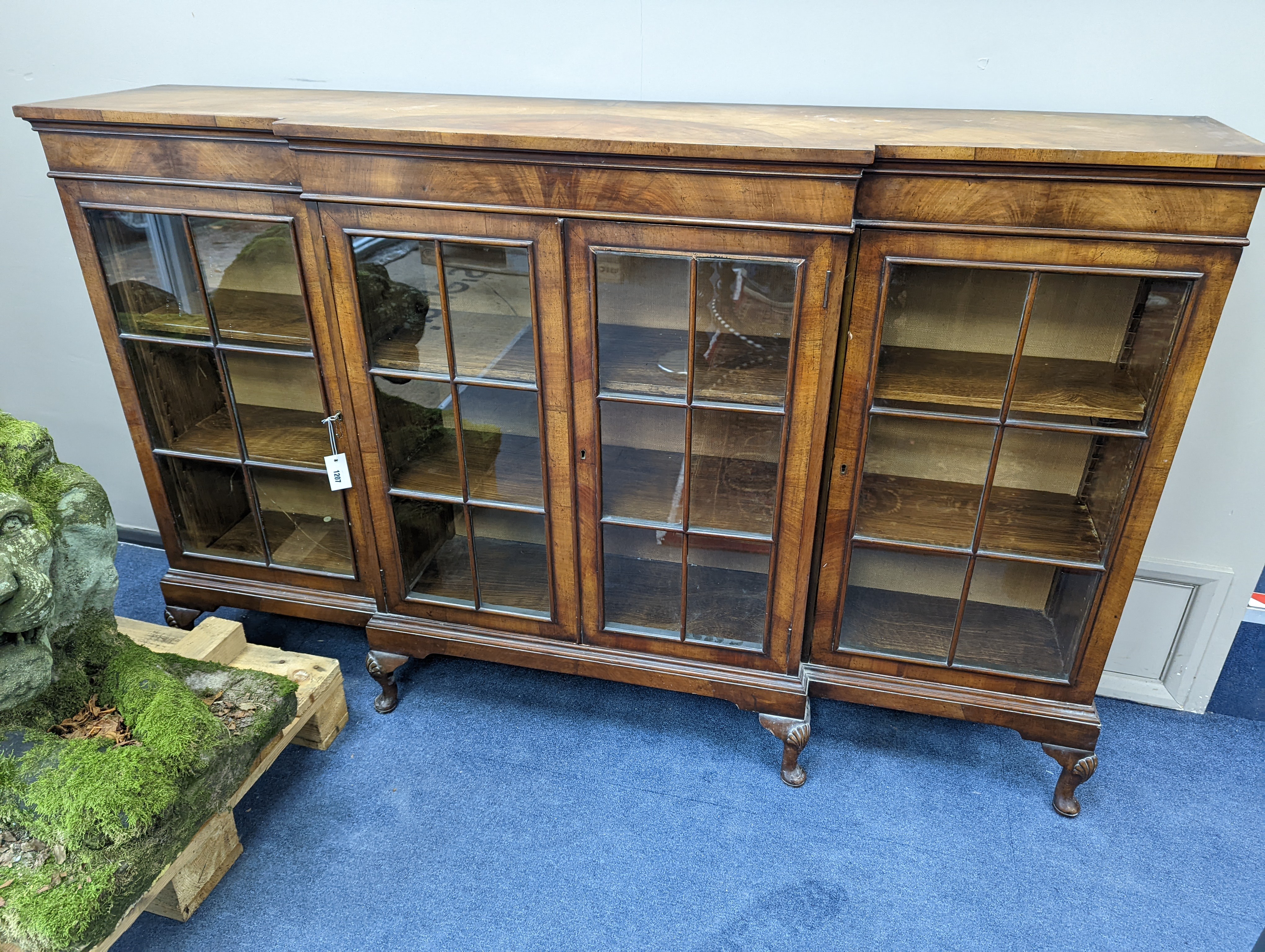 A Queen Anne revival walnut dwarf breakfront bookcase, length 182cm, depth 38cm, height 113cm